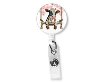 Brown and White Swinging Cow Badge Reel