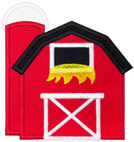 Red barn with a black roof and  silo