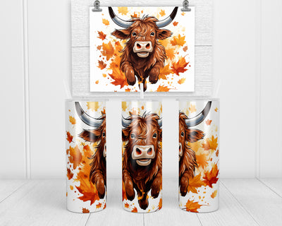 Cartoon Leaping Fall Highland Cow 20 oz insulated tumbler with lid and straw