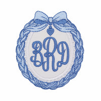 Blue coquette bow monogram embroidered patch with heart charm detail, personalized oval patch for bags jackets baby blankets and nursery projects