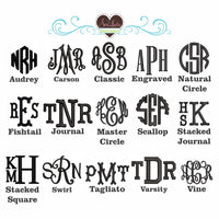A collage of monogram lettering styles on a white background, with sample names under each design such as Audrey, Carson, Classic, Engraved, Natural Circle, Fishtail, Journal, Master Circle, Scallop, Stacked Journal, Stacked Square, Swirl, Tagliato, Varsity, and Vine. A heart-shaped logo at the top reads 'Specialty Embroidery'.